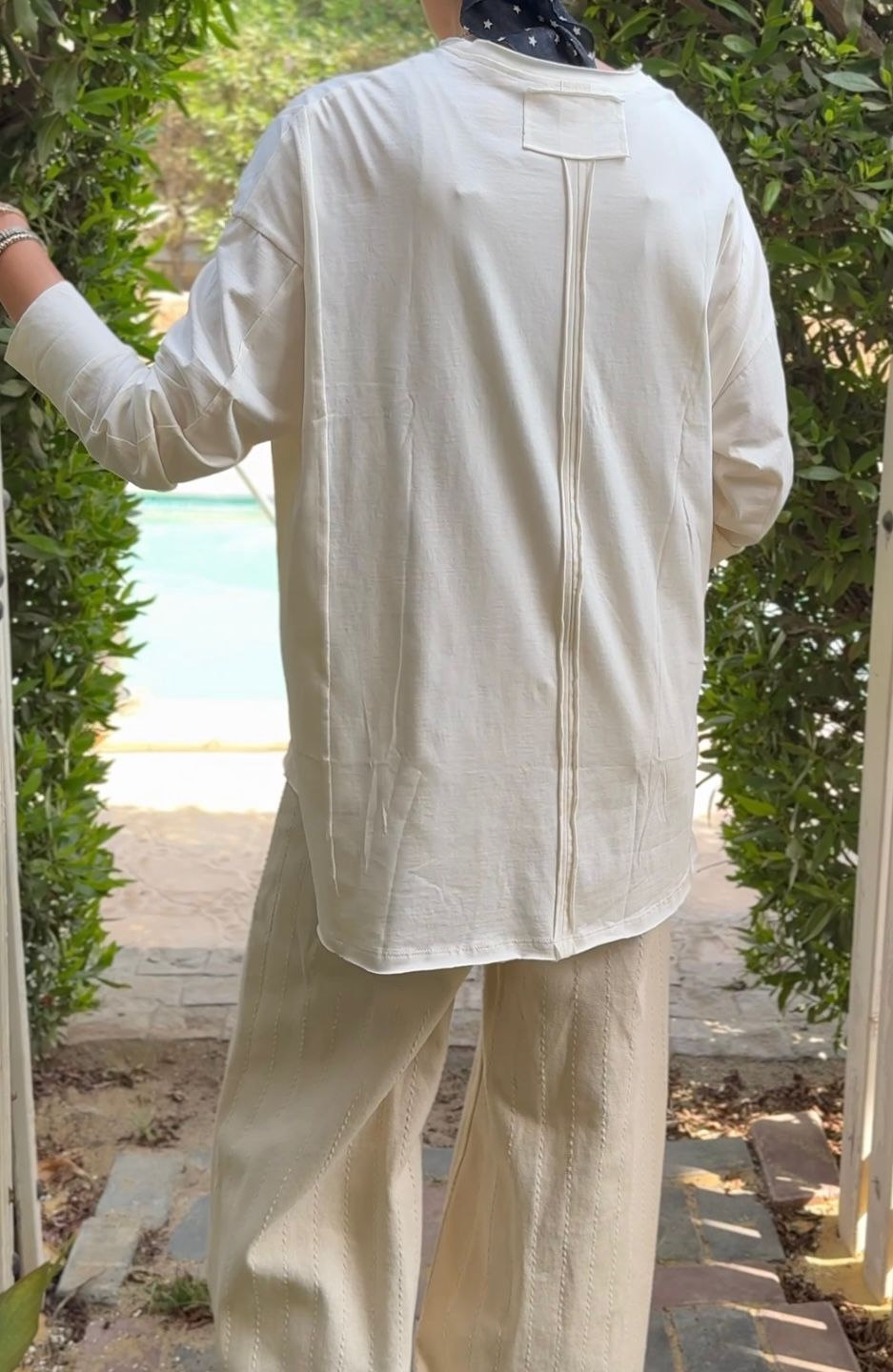 One size round neck cotton top unfinished at the back in light beige